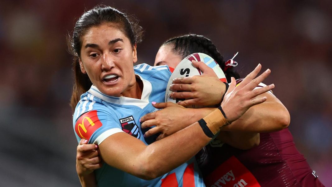 BRISBANE, AUSTRALIA - MAY 01: Olivia Kernick of the Bluesis tackled during game one of the Women's State of Origin series between the Queensland Maroons and New South Wales Blues at Suncorp Stadium on May 01, 2025 in Brisbane, Australia. (Photo by Chris Hyde/Getty Images)
