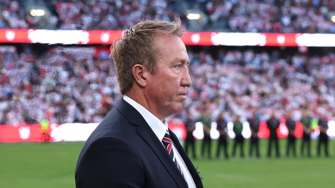SYDNEY, AUSTRALIA - APRIL 25: Trent Robinson, head coach of the Roosters walks onto the field to attend an ANZAC Day ceremony prior to the round eight NRL match between the Sydney Roosters and St George Illawarra Dragons at Allianz Stadium on April 25, 2025, in Sydney, Australia. (Photo by Cameron Spencer/Getty Images)